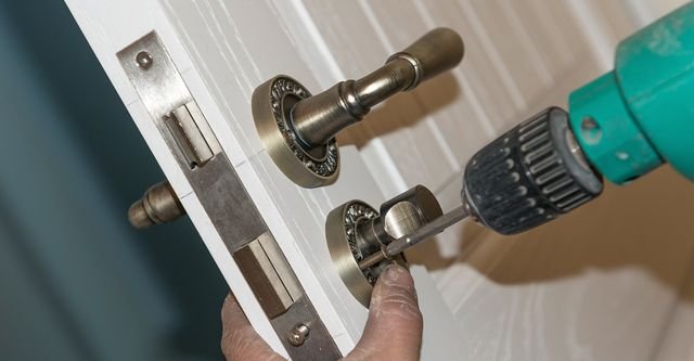 Door locksmith repairing residential door lock in Stony Point NY