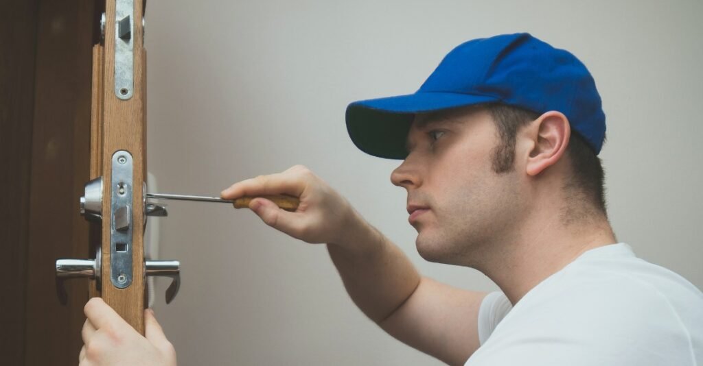 Locksmith technician fixing a front-door lock in Suffern, NY