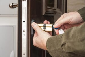 Locksmith repairing a residential door lock in Mount Vernon NY