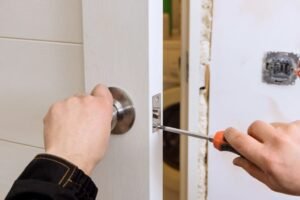 Locksmith repairing a residential door lock in Upper Nyack NY