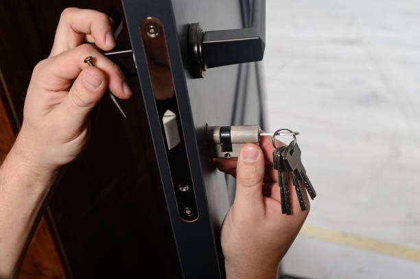 Door locksmith repairing front door lock in Stony Point NY