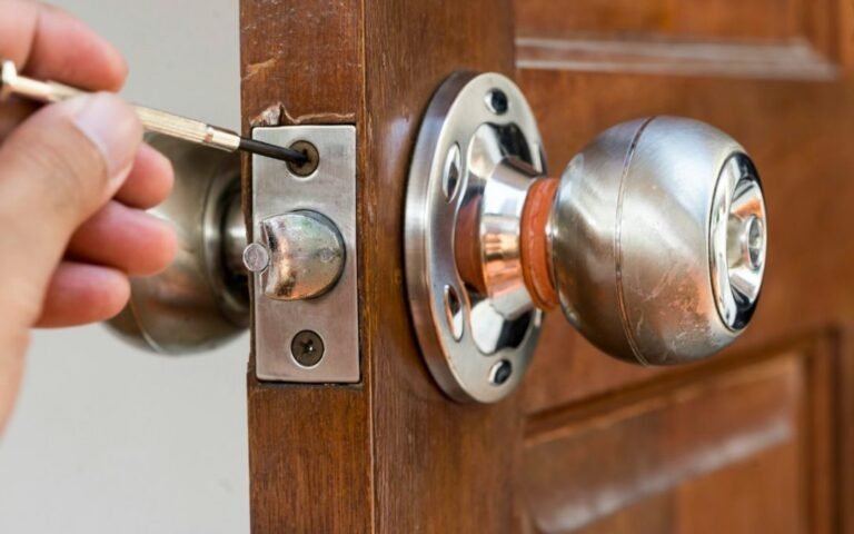 Door locksmith repairing residential front door lock in Chestnut Ridge, NY