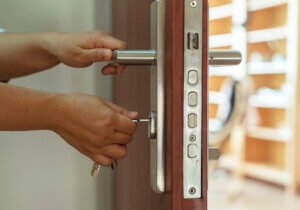high security lock installation bellerose ny man installihand holding the inserted key in the door lockng high security lock