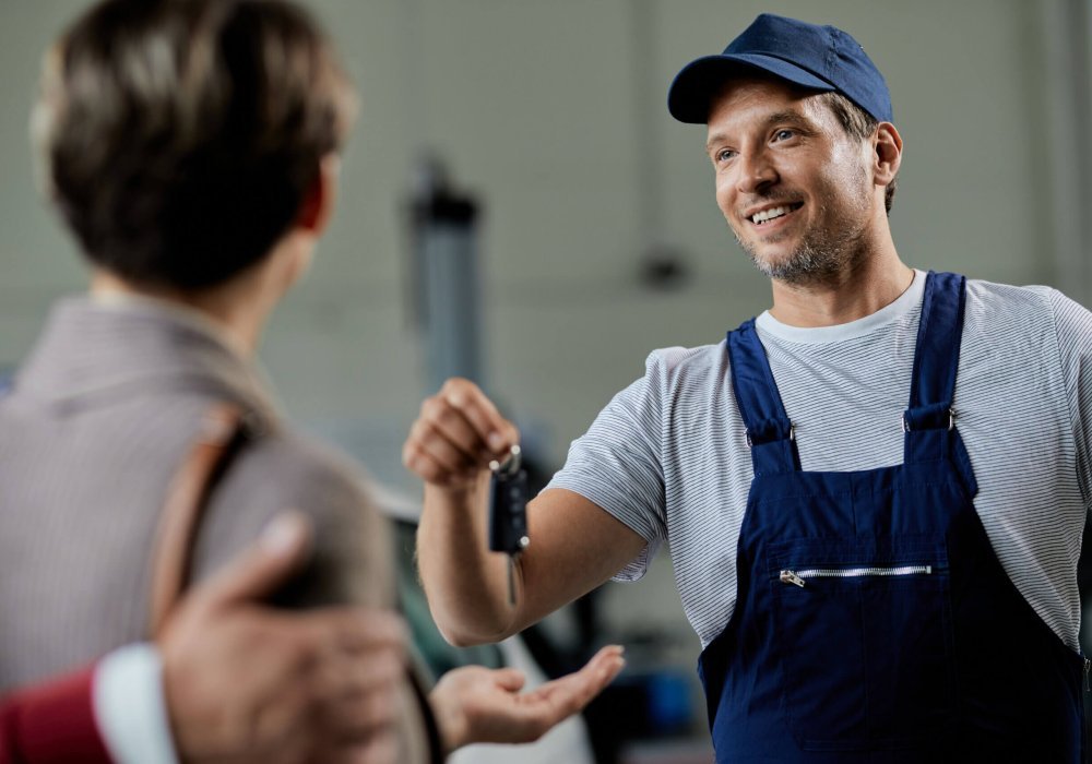 What to Do After Losing Your House Keys a locksmith giving a key to a woman